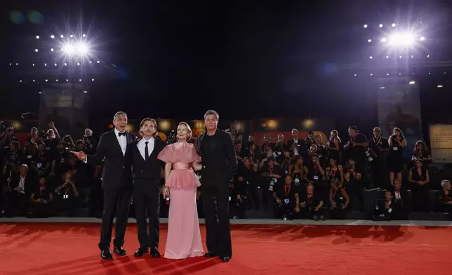 George Clooney, from left, Austin Abrams, Amy Ryan and Brad Pitt pose for photographers upon arrival for the premiere of the film 'Wolfs' during the 81st edition of the Venice Film Festival in Venice, Italy, on Sunday, Sept. 1, 2024. (Photo by Joel C Ryan/Invision/AP)