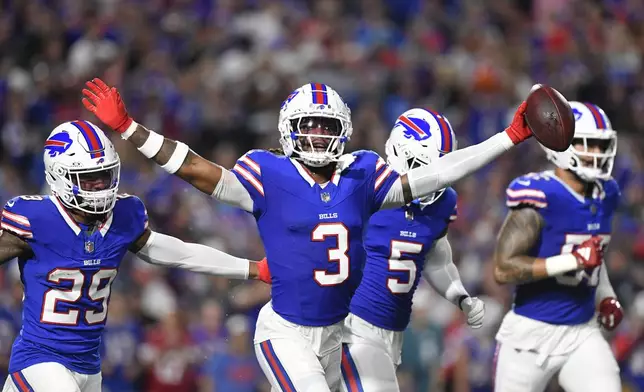 Buffalo Bills safety Damar Hamlin (3) celebrates after intercepting a pass during the first half of an NFL football game against the Jacksonville Jaguars, Monday, Sept. 23, 2024, in Orchard Park, NY. (AP Photo/Adrian Kraus)