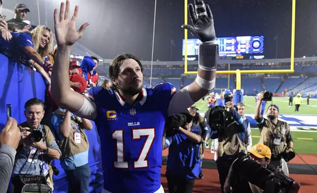 Buffalo Bills quarterback Josh Allen (17) walks off the field after a win over the Jacksonville Jaguars in an NFL football game Monday, Sept. 23, 2024, in Orchard Park, NY. (AP Photo/Adrian Kraus)