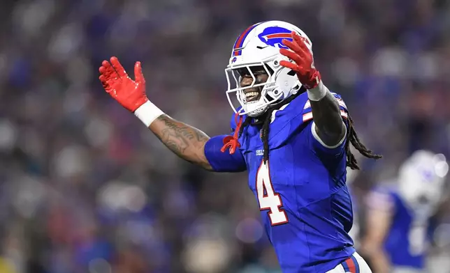 Buffalo Bills running back James Cook (4) celebrates after scoring a rushing touchdown during the first half of an NFL football game against the Jacksonville Jaguars, Monday, Sept. 23, 2024, in Orchard Park, NY. (AP Photo/Adrian Kraus)