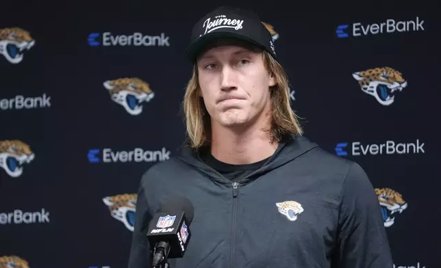 Jacksonville Jaguars quarterback Trevor Lawrence answers questions after an NFL football game against the Buffalo Bills, Monday, Sept. 23, 2024, in Orchard Park, NY. (AP Photo/Steven Senne)