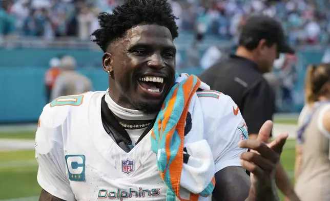 Miami Dolphins wide receiver Tyreek Hill gestures after an NFL football game against the Jacksonville Jaguars, Sunday, Sept. 8, 2024, in Miami Gardens, Fla. The Dolphins defeated the Jaguars 20-17. (AP Photo/Wilfredo Lee)