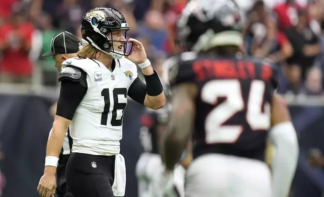 Jacksonville Jaguars quarterback Trevor Lawrence (16) reacts after being stopped on a fourth down play during the second half of an NFL football game against the Houston Texans, Sunday, Sept. 29, 2024, in Houston. (AP Photo/Eric Gay)