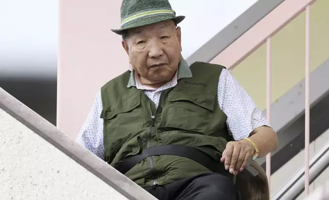 Iwao Hakamada, 88-year-old former boxer who has been on death row for nearly six decades after his murder conviction that his lawyers said was based on forced confession and fabricated evidence, goes for a walk in Hamamatsu, Shizuoka prefecture, central Japan Thrusday, Sept. 26, 2024. (Kyodo News via AP)