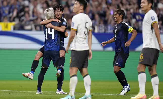 Japan's Junya Ito, 14, celebrates his goal during a World Cup and AFC Asian Qualifier between Japan and China at Saitama Stadium 2002 in Saitama, north of Tokyo, Thursday, Sept. 5, 2024.(AP Photo/Shuji Kajiyama)