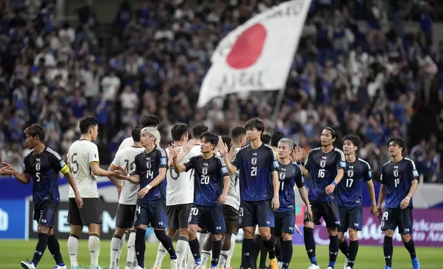 Japan team celebrate after defeating China after a World Cup and AFC Asian Qualifier between Japan and China at Saitama Stadium 2002 in Saitama, north of Tokyo, Thursday, Sept. 5, 2024.(AP Photo/Shuji Kajiyama)