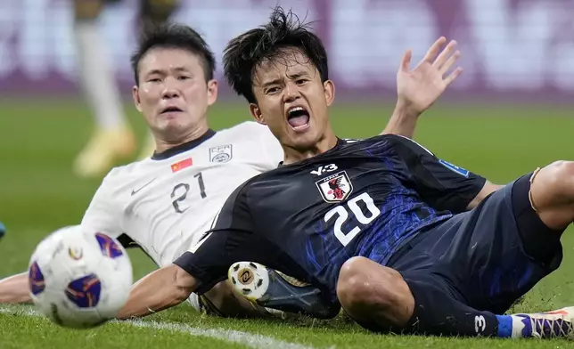 Japan's Takefusa Kubo and China's Li Yuanyi compete the ball during a World Cup and AFC Asian Qualifier between Japan and China at Saitama Stadium 2002 in Saitama, north of Tokyo, Thursday, Sept. 5, 2024.(AP Photo/Shuji Kajiyama)