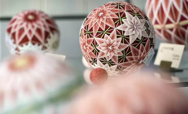 The temari balls are displayed at Sanuki Kagari Temari in Kawaramachi, Kagawa prefecture, Japan, on Sept. 5, 2024. (AP Photo/Ayaka McGill)