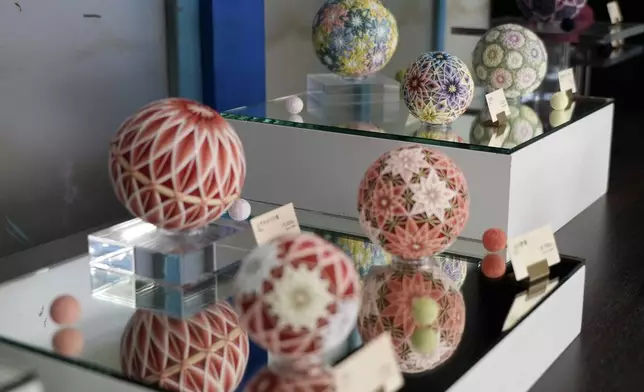 The temari balls are displayed at Sanuki Kagari Temari in Kawaramachi, Kagawa prefecture, Japan, on Sept. 5, 2024. (AP Photo/Ayaka McGill)