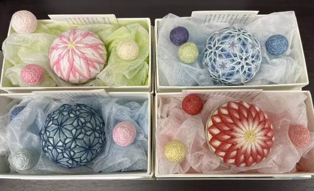 Sanuki Kagari Temari balls are in a gift box in Eiko Araki's studio in Kawaramachi, Kagawa prefecture, Japan, on Sept. 5, 2024. (AP Photo/Yuri Kageyama)