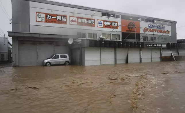 A street is flooded in Wajima, Japan, Sunday, Sept. 22, 2024, following heavy rain in central Japan's Noto peninsula area, where a devastating earthquake took place on Jan. 1. (Yasuko Kishimoto/Kyodo News via AP)