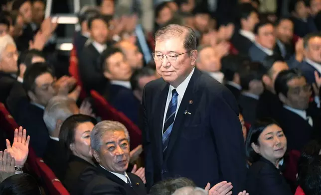 Shigeru Ishiba, center, acknowledges after he was elected as new head of Japan's ruling Liberal Democratic Party (LDP) during the party's leadership election Friday, Sept. 27, 2024, in Tokyo. (AP Photo/Hiro Komae, Pool)