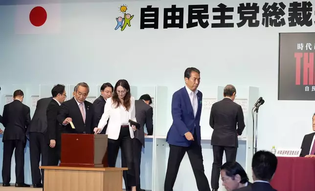 Party members cast their ballots at the Liberal Democratic Party's (LDP) leadership election Friday, Sept. 27, 2024, in Tokyo. (AP Photo/Hiro Komae, Pool)