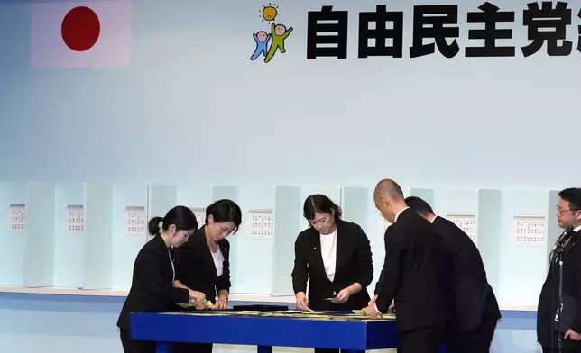 Officials count ballots during the Liberal Democratic Party's (LDP) leadership election at the LDP headquarters Friday, Sept. 27, 2024, in Tokyo. (AP Photo/Hiro Komae, Pool)