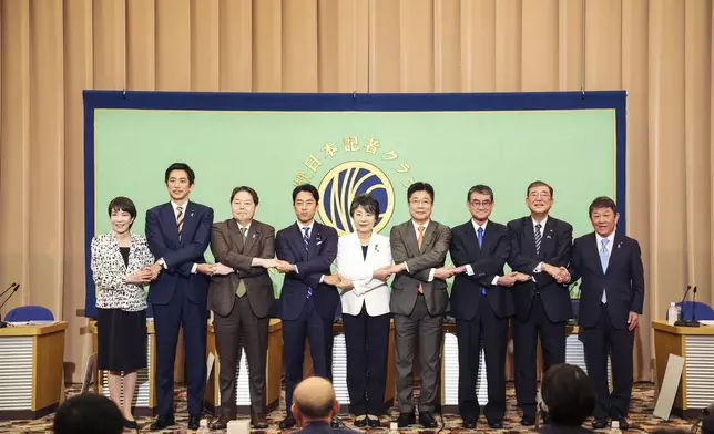 FILE - Candidates for Japan's ruling Liberal Democratic Party's (LDP) presidential election pose for a photo before a debate at the Japan National Press Club in Tokyo, on Sept. 14, 2024. From left are Economic Security Minister Sanae Takaichi, former Economic Security Minister Takayuki Kobayashi, Chief Cabinet Secretary Yoshimasa Hayashi, former Environment Minister Shinjiro Koizumi, Foreign Minister Yoko Kamikawa, former Chief Cabinet Secretary Katsunobu Kato, Digital Minister Taro Kono, former Defense Minister Shigeru Ishiba and Liberal Democratic Party Secretary General Toshimitsu Motegi. (Takashi Aoyama/Pool Photo via AP, File)