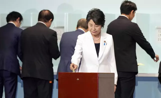 Japan's Foreign Minister and one of the candidates Yoko Kamikawa casts her ballot at the Liberal Democratic Party's (LDP) leadership election Friday, Sept. 27, 2024, in Tokyo. (AP Photo/Hiro Komae, Pool)