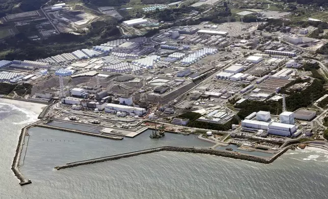 FILE - This aerial view shows the Fukushima Daiichi nuclear power plant in Fukushima, northern Japan, on Aug. 24, 2023, shortly after its operator Tokyo Electric Power Company Holdings TEPCO began releasing its first batch of treated radioactive water into the Pacific Ocean. (Kyodo News via AP, File)