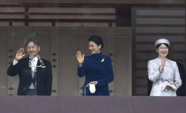 FILE- Japan's Emperor Naruhito, from left, Empress Masako and their daughter Princess Aiko wave to well-wishers from the balcony of the Imperial Palace in Tokyo on Friday, Feb. 23, 2024. (Tomohiro Ohsumi/Pool Photo via AP)