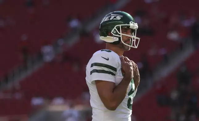 New York Jets quarterback Aaron Rodgers warms up before an NFL football game against the San Francisco 49ers in Santa Clara, Calif., Monday, Sept. 9, 2024. (AP Photo/Jed Jacobsohn)