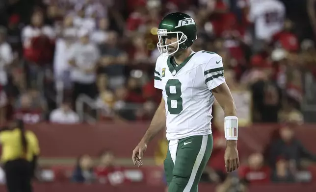 New York Jets quarterback Aaron Rodgers walks on the field during the second half of an NFL football game against the San Francisco 49ers in Santa Clara, Calif., Monday, Sept. 9, 2024. (AP Photo/Jed Jacobsohn)