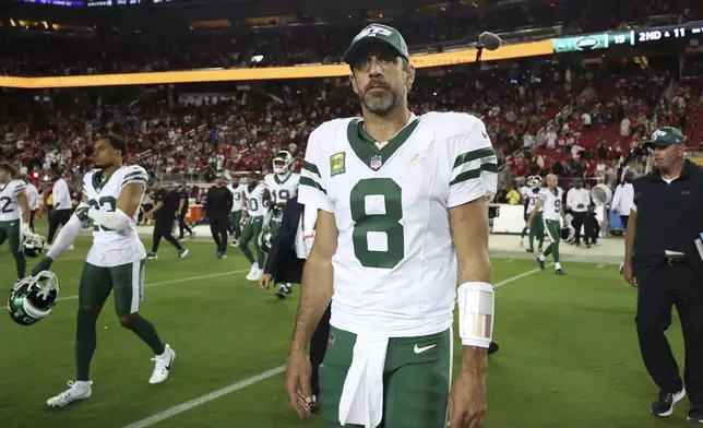 New York Jets quarterback Aaron Rodgers (8) walks on the field after an NFL football game against the San Francisco 49ers in Santa Clara, Calif., Monday, Sept. 9, 2024. (AP Photo/Jed Jacobsohn)