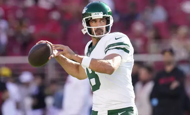 New York Jets quarterback Aaron Rodgers warms up before an NFL football game against the San Francisco 49ers in Santa Clara, Calif., Monday, Sept. 9, 2024. (AP Photo/Godofredo A. Vásquez)