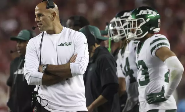 New York Jets head coach Robert Saleh, left, walks on the sideline during the second half of an NFL football game against the San Francisco 49ers in Santa Clara, Calif., Monday, Sept. 9, 2024. (AP Photo/Jed Jacobsohn)