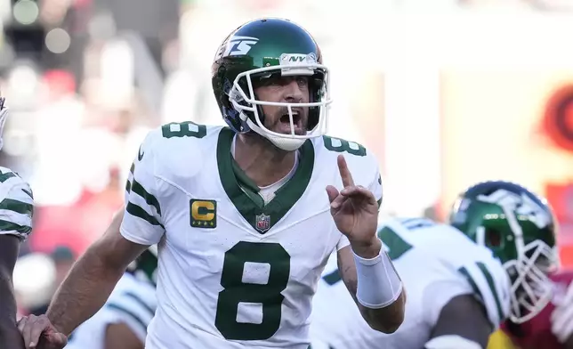 New York Jets quarterback Aaron Rodgers (8) signals toward teammates during the first half of an NFL football game against the San Francisco 49ers in Santa Clara, Calif., Monday, Sept. 9, 2024. (AP Photo/Godofredo A. Vásquez)