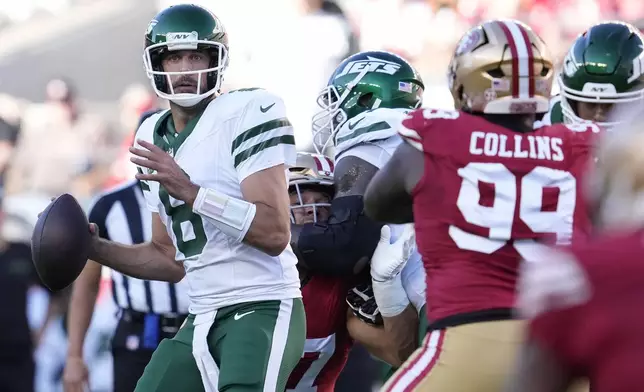 New York Jets quarterback Aaron Rodgers (8) looks to pass the ball during the first half of an NFL football game against the San Francisco 49ers in Santa Clara, Calif., Monday, Sept. 9, 2024. (AP Photo/Godofredo A. Vásquez)