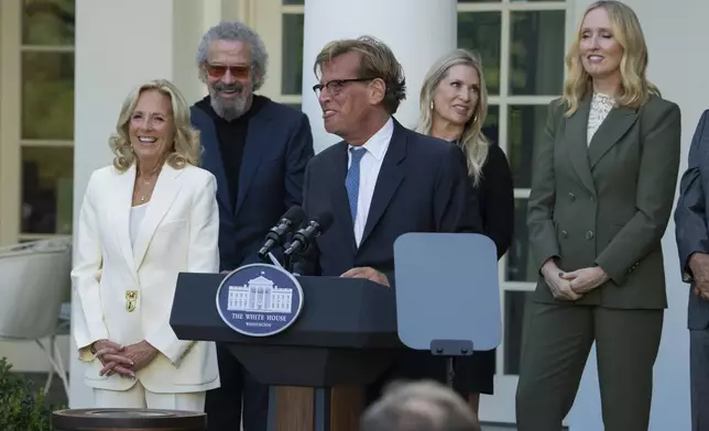 First lady Jill Biden, listens to actor Aaron Sorkin speaks at an event on the Rose Garden at the White House to mark the 25th anniversary of the television series, The West Wing, Friday, Sept. 20, 2024, in Washington. (AP Photo/Manuel Balce Ceneta)