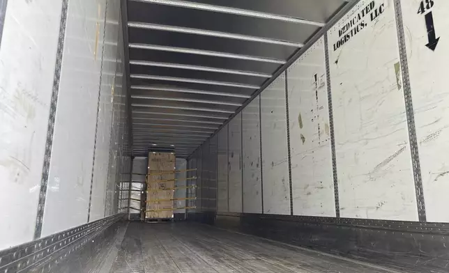 A crate holding a statue of Johnny Cash, destined for the U.S. Capitol, sits in the back of a tractor trailer parked outside the Arkansas Capitol in Little Rock, Ark., Thursday, Sept. 5, 2024. (AP Photo/Andrew DeMillo)