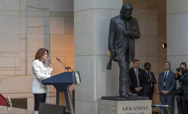 Daughter Rosanne Cash speaks at the unveiling of a bronze statue of singer Johnny Cash, created by Little Rock sculptor Kevin Kresse, in Emancipation Hall at the Capitol in Washington, Tuesday, Sept. 24, 2024. (AP Photo/Ben Curtis)