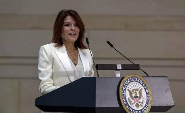 Rosanne Cash speaks at the unveiling of a bronze statue of her father, Johnny Cash, created by Little Rock sculptor Kevin Kresse, in Emancipation Hall at the Capitol in Washington, Tuesday, Sept. 24, 2024. (AP Photo/Ben Curtis)