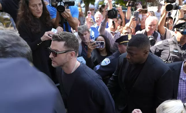 Justin Timberlake, left, walks into court for a hearing, Friday, Sept. 13, 2024, in Sag Harbor, N.Y. (AP Photo/Pamela Smith)