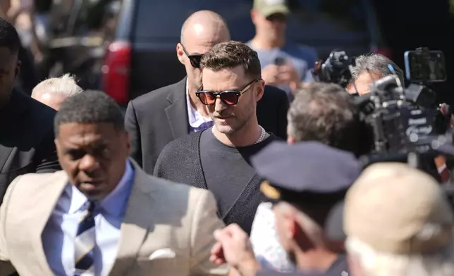 Justin Timberlake, center, walks into court for a hearing, Friday, Sept. 13, 2024, in Sag Harbor, N.Y. (AP Photo/Pamela Smith)