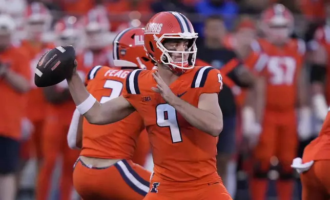 Illinois quarterback Luke Altmyer passes during the first half of an NCAA college football game against Kansas on Saturday, Sept. 7, 2024, in Champaign, Ill. (AP Photo/Charles Rex Arbogast)