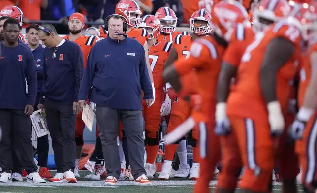 Illinois head coach Bret Bielema watches his team during the first half of an NCAA college football game against Kansas on Saturday, Sept. 7, 2024, in Champaign, Ill. (AP Photo/Charles Rex Arbogast)