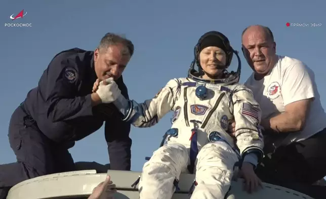 In this photo taken from video released by Roscosmos space corporation, rescue team members help NASA astronaut Tracy Dyson to leave the capsule shortly after the landing of the Russian Soyuz MS-25 space capsule carrying the NASA astronaut Tracy Dyson and the Roscosmos cosmonauts Oleg Kononenko and Nikolai Chub, south-east of the Kazakh town of Zhezkazgan, Kazakhstan, Monday, Sept. 23, 2024. (Roscosmos space corporation via AP)