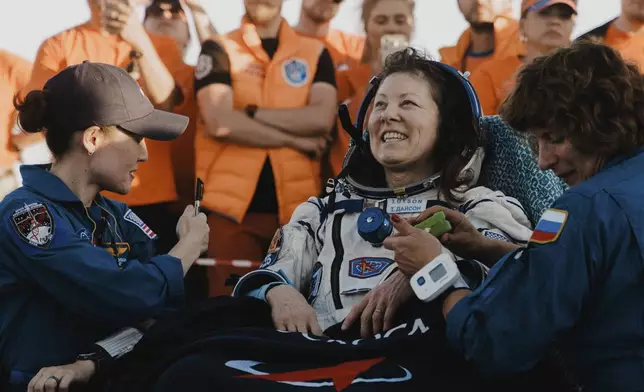 In this photo released by Roscosmos space corporation, NASA astronaut Tracy Dyson sits in a chair shortly after the landing of the Russian Soyuz MS-25 space capsule carrying NASA astronaut Tracy Dyson, Roscosmos cosmonauts Oleg Kononenko and Nikolai Chub, south-east of the Kazakh town of Zhezkazgan, Kazakhstan, Monday, Sept. 23, 2024. (Ivan Timoshenko, Roscosmos space corporation via AP)