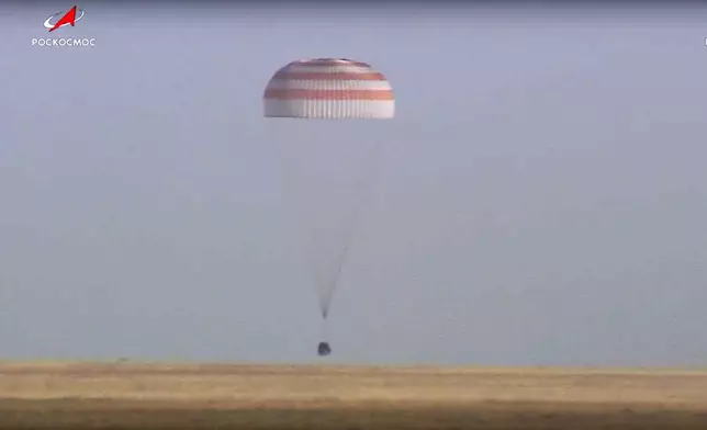 In this photo taken from video released by Roscosmos space corporation, Russian Soyuz MS-25 space capsule carrying the NASA astronaut Tracy Dyson and the Roscosmos cosmonauts Oleg Kononenko and Nikolai Chub lands south-east of the Kazakh town of Zhezkazgan, Kazakhstan, Monday, Sept. 23, 2024. (Roscosmos space corporation via AP)