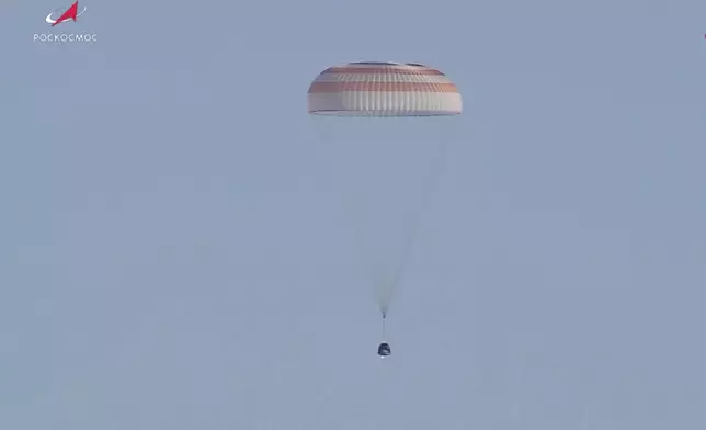 In this photo taken from video released by Roscosmos space corporation, Russian Soyuz MS-25 space capsule carrying the NASA astronaut Tracy Dyson and the Roscosmos cosmonauts Oleg Kononenko and Nikolai Chub descends south-east of the Kazakh town of Zhezkazgan, Kazakhstan, Monday, Sept. 23, 2024. (Roscosmos space corporation via AP)