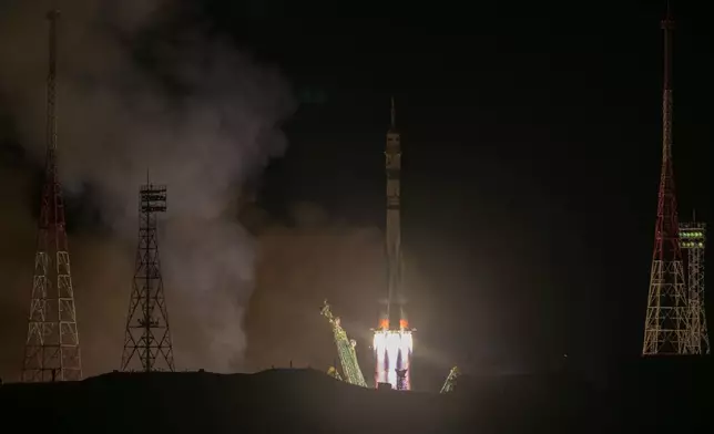 In this image provided by NASA, a Soyuz rocket carrying Roscosmos cosmonauts Alexey Ovchinin, Ivan Vagner and NASA astronaut Don Pettit, a new crew to the International Space Station (ISS), blasts off from the Russian leased Baikonur cosmodrome in Kazakhstan, Wednesday, Sept. 11, 2024. (Bill Ingalls/NASA via AP)