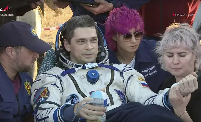 In this photo taken from video released by Roscosmos space corporation, Roscosmos cosmonaut Nikolai Chub sits in a chair shortly after the landing of the Russian Soyuz MS-25 space capsule carrying NASA astronaut Tracy Dyson, Roscosmos cosmonauts Oleg Kononenko and Nikolai Chub, south-east of the Kazakh town of Zhezkazgan, Kazakhstan, Monday, Sept. 23, 2024. (Roscosmos space corporation via AP)