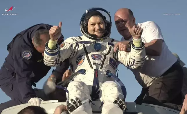 In this photo taken from video released by Roscosmos space corporation, rescue team members help Roscosmos cosmonaut Oleg Kononenko to leave the capsule shortly after the landing of the Russian Soyuz MS-25 space capsule carrying the NASA astronaut Tracy Dyson and the Roscosmos cosmonauts Oleg Kononenko and Nikolai Chub, south-east of the Kazakh town of Zhezkazgan, Kazakhstan, Monday, Sept. 23, 2024. (Roscosmos space corporation via AP)