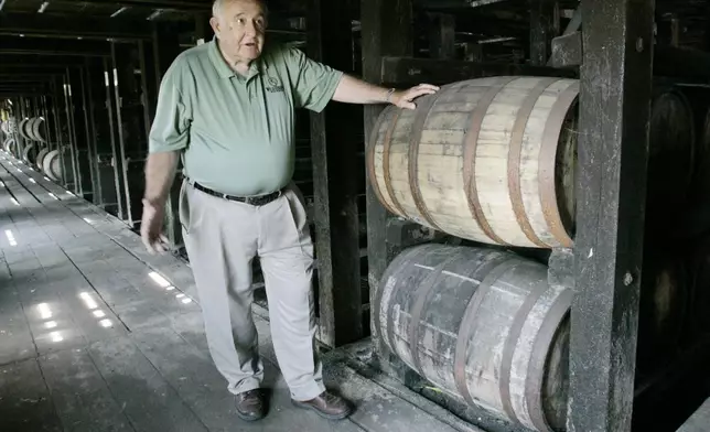 FILE - Wild Turkey master distiller Jimmy Russell talks about bourbon making as he stands in a warehouse in Lawrenceburg, Ky., Wednesday, June 18, 2008. (AP Photo/Ed Reinke, File)