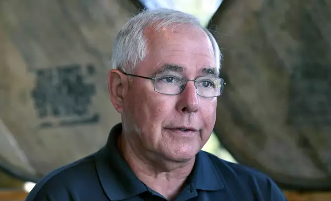 Eddie Russell, master distiller, and son of 89-year-old Jimmy Russell, the "Buddha of Bourbon" talks about having three generations of the Russell family involved in the bourbon industry at the Wild Turkey Distillery in Lawrenceburg, Ky., Wednesday, Aug. 28, 2024. (AP Photo/Timothy D. Easley)