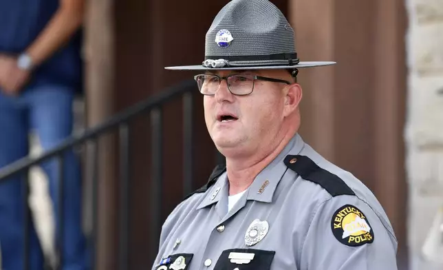 Kentucky State Police Public Information Officer Master Seargeant Scottie Pennington addresses the media to give an update on the efforts to find the suspect in the shooting at I-75 at the Livingston Ky. exit at the Laurel County Sheriff's Office in London, Ky., Monday, Sept. 9, 2024. (AP Photo/Timothy D. Easley)