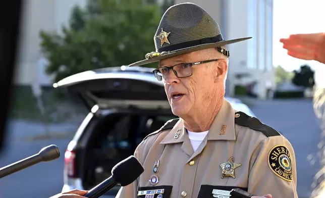 Deputy Gilbert Acciardo, Public information Officer with the Laurel County Sheriff's Office, gives details on the progress of the investigation of the shooting along I-75 in London, Ky., Sunday, Sept. 8, 2024. (AP Photo/Timothy D. Easley)