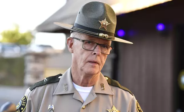 Deputy Gilbert Acciardo, Public information Officer with the Laurel County Sheriff's Office, gives an update on the progress of the search for the suspect linked to the shooting along I-75 in London, Ky., Sunday, Sept. 8, 2024. (AP Photo/Timothy D. Easley)