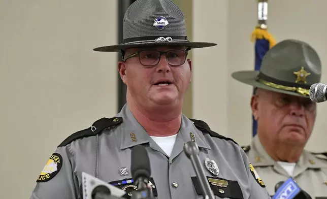 Kentucky State Police Public Information Officer Master Sergeant Scottie Pennington gives an update at the London Community Center in London, Ky., Sunday, Sept. 8, 2024, on the efforts to find the suspect in the Saturday shooting at Interstate 75 near Livingston, Ky. (AP Photo/Timothy D. Easley)